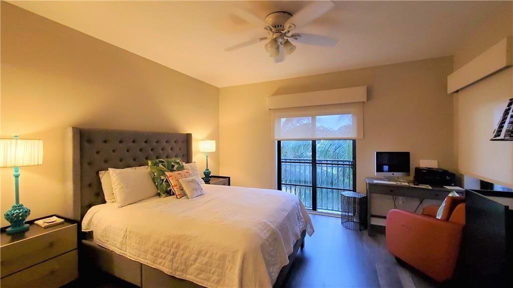 2509 North Ocean Boulevard, Unit 576 Fort Lauderdale, FL 33305 - Photo 15 of 22 a bedroom with a bed and a flat screen tv