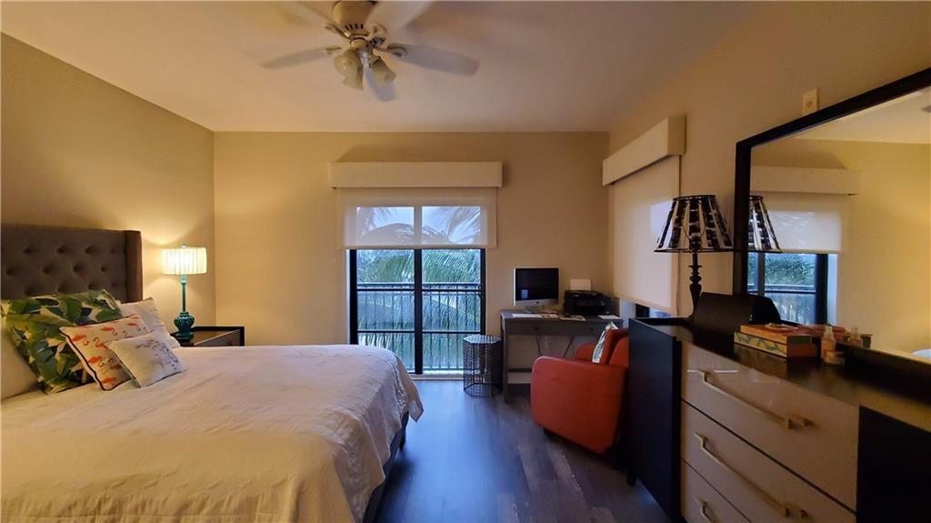 2509 North Ocean Boulevard, Unit 576 Fort Lauderdale, FL 33305 - Photo 16 of 22 a bed room with a bed window and a couch