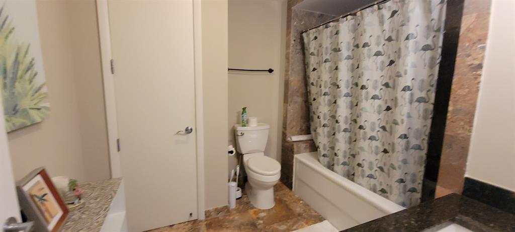 2509 North Ocean Boulevard, Unit 576 Fort Lauderdale, FL 33305 - Photo 17 of 22 a bathroom with a toilet and shower