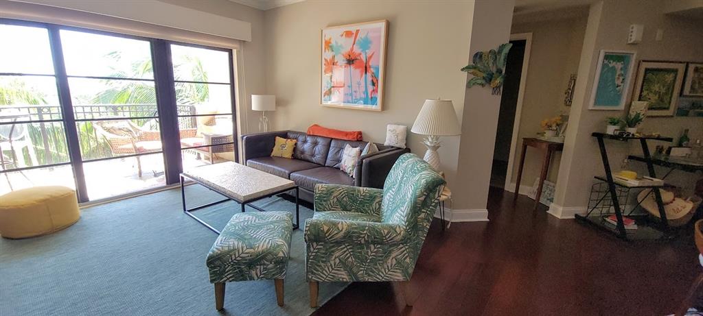 2509 North Ocean Boulevard, Unit 576 Fort Lauderdale, FL 33305 - Photo 10 of 22 a living room with furniture and a floor to ceiling window