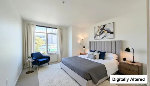 a bedroom with a bed and window