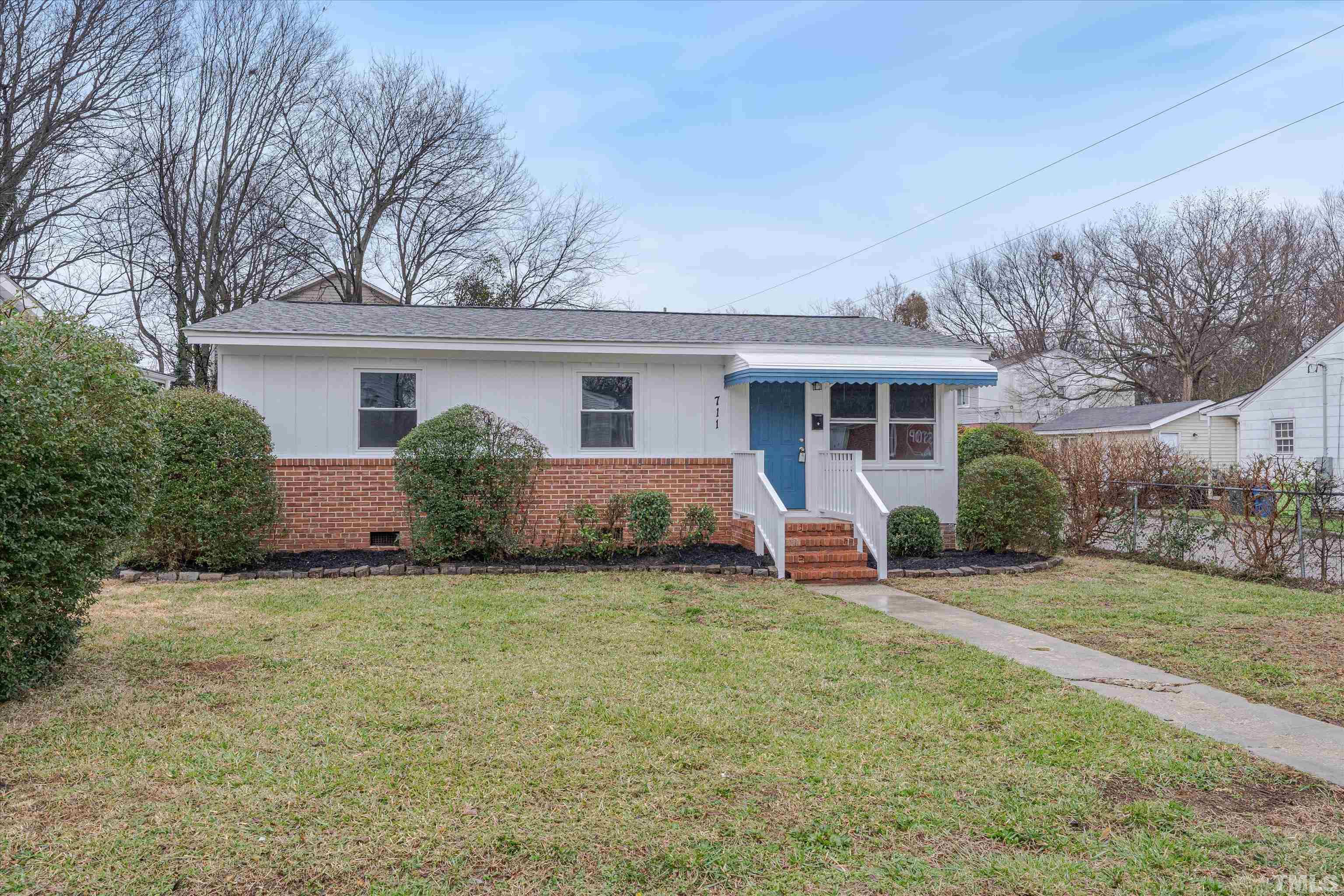 711 Coleman Street Raleigh, NC 27610 - Photo 1 of 14 front view of a house with a yard