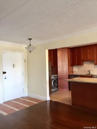 a view of a kitchen with a sink and a stove top oven