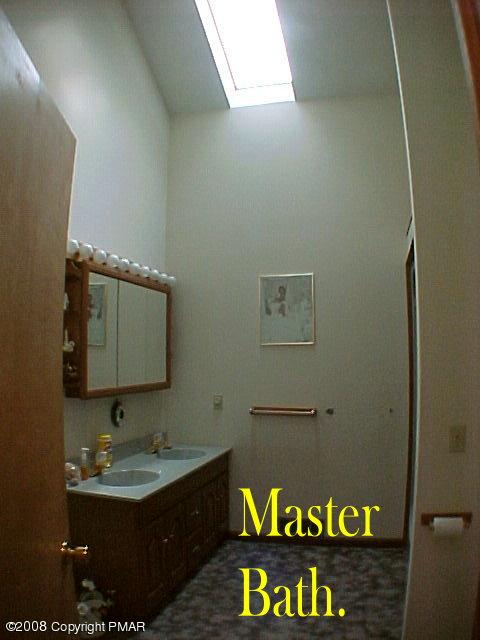 Red Rock Road Cresco, PA 18326 - Photo 7 of 11 a bathroom with a sink and mirror