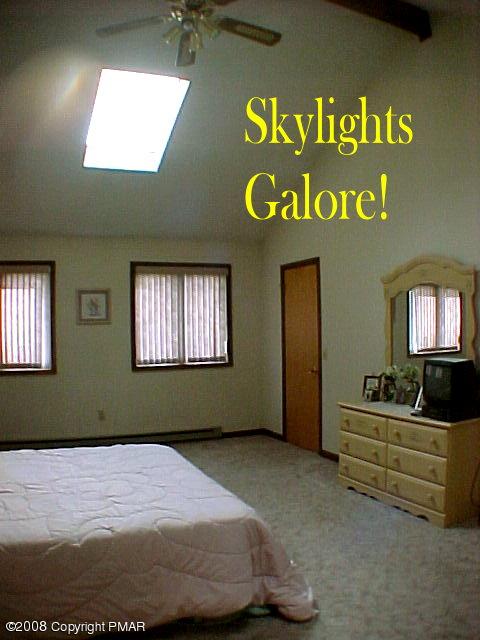 Red Rock Road Cresco, PA 18326 - Photo 8 of 11 a bedroom with a bed and window