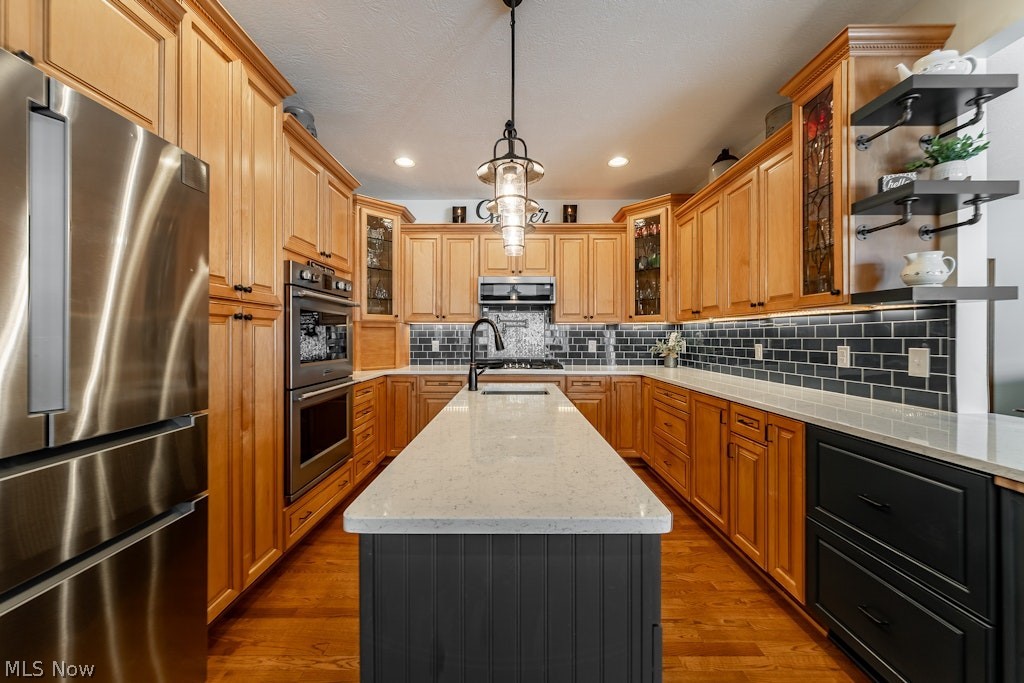 41341 Ravines Edge Way Lagrange, OH 44050 - Photo 14 of 50 This gourmet kitchen has ample amounts of Corian Quartz stone surface countertops accented with a shiny backsplash tile