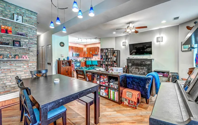 a living room with fireplace furniture and a flat screen tv