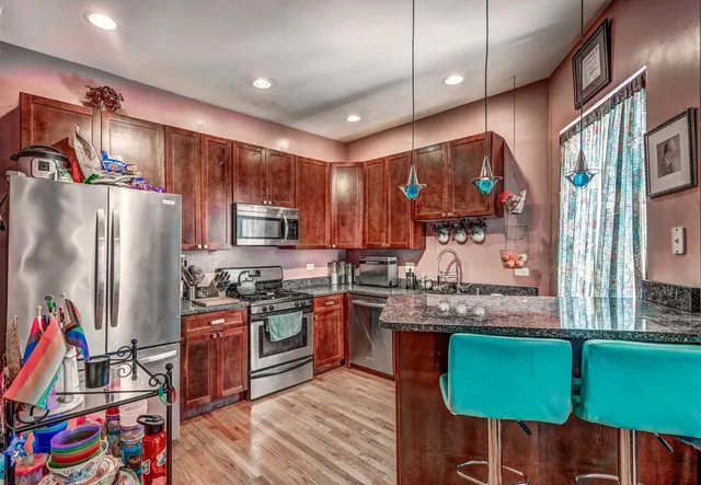 a kitchen with lots of appliances and cabinets