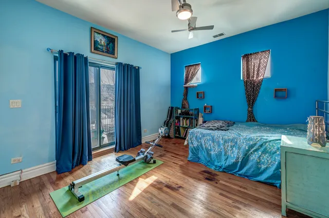 a bedroom with bed and balcony