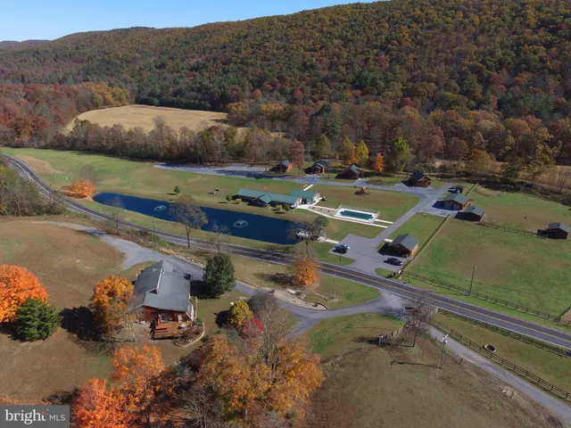an aerial view of a house with a swimming pool