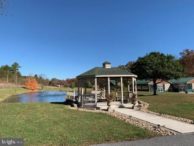 a bed sitting in a bathroom next to a wooden wall