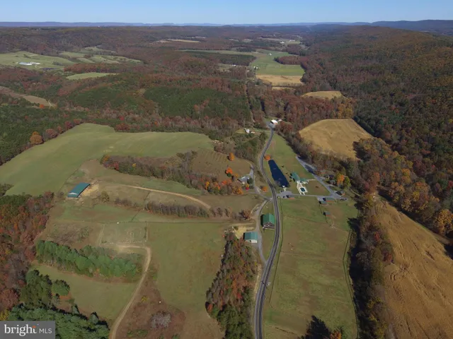 an aerial view of a house with a garden