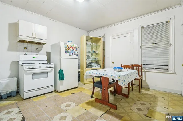 a living room with furniture and a chair