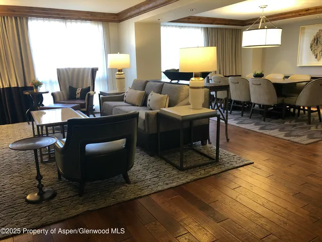 a living room with fireplace furniture and a window