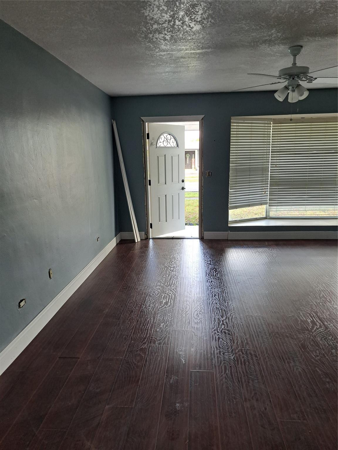 730 Southwest 67th Terrace Pembroke Pines, FL 33023 - Photo 1 of 6 wooden floor in an empty room with a window