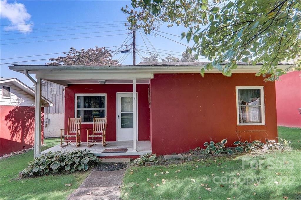front view of a house with a yard
