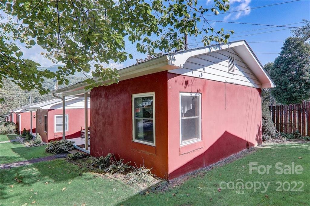 1555 Soco Road, Unit 3 Maggie Valley, NC 28751 - Photo 11 of 40 a front view of a house with garden