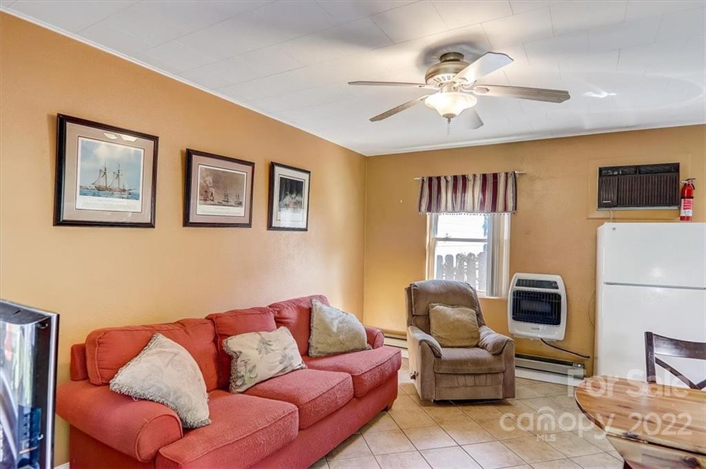 1555 Soco Road, Unit 3 Maggie Valley, NC 28751 - Photo 15 of 40 a living room with furniture and a couch