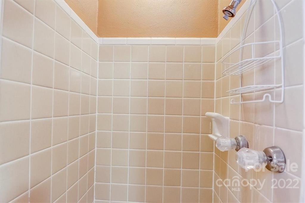 1555 Soco Road, Unit 3 Maggie Valley, NC 28751 - Photo 33 of 40 a bathroom with a shower