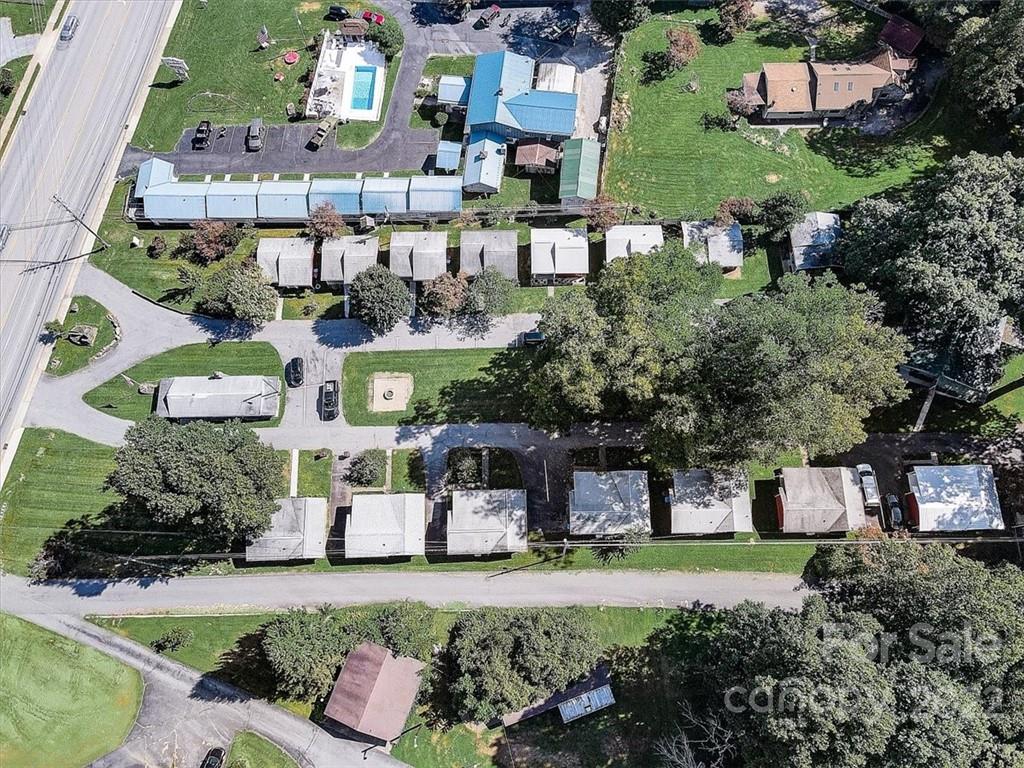 1555 Soco Road, Unit 3 Maggie Valley, NC 28751 - Photo 34 of 40 an aerial view of a house with a yard and lake view