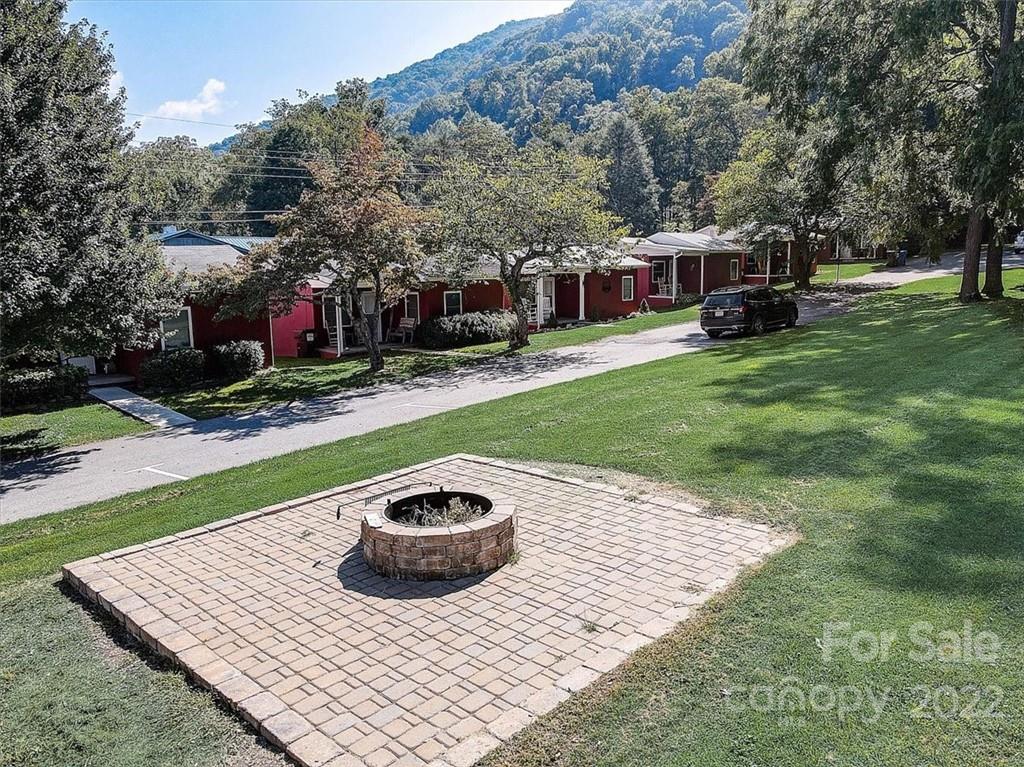 1555 Soco Road, Unit 3 Maggie Valley, NC 28751 - Photo 38 of 40 a view of a wooden deck and a backyard