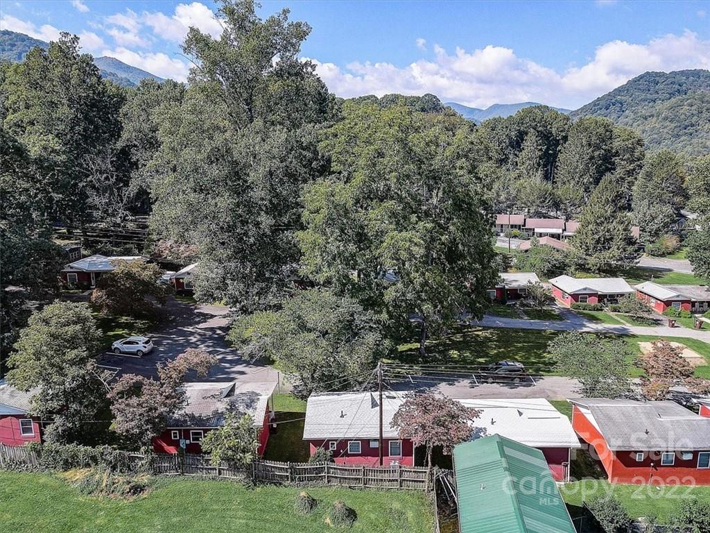 1555 Soco Road, Unit 3 Maggie Valley, NC 28751 - Photo 40 of 40 an aerial view of house with yard and mountain view in back