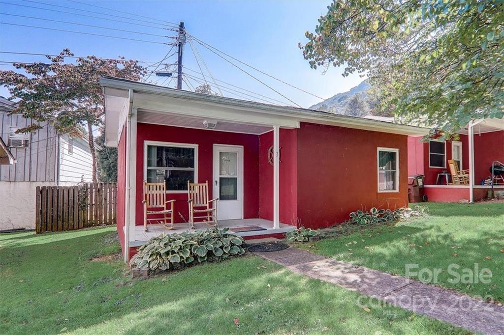 1555 Soco Road, Unit 3 Maggie Valley, NC 28751 - Photo 5 of 40 front view of a house with a yard