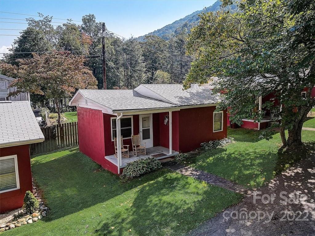 1555 Soco Road, Unit 3 Maggie Valley, NC 28751 - Photo 9 of 40 a view of a house with a yard porch and sitting area
