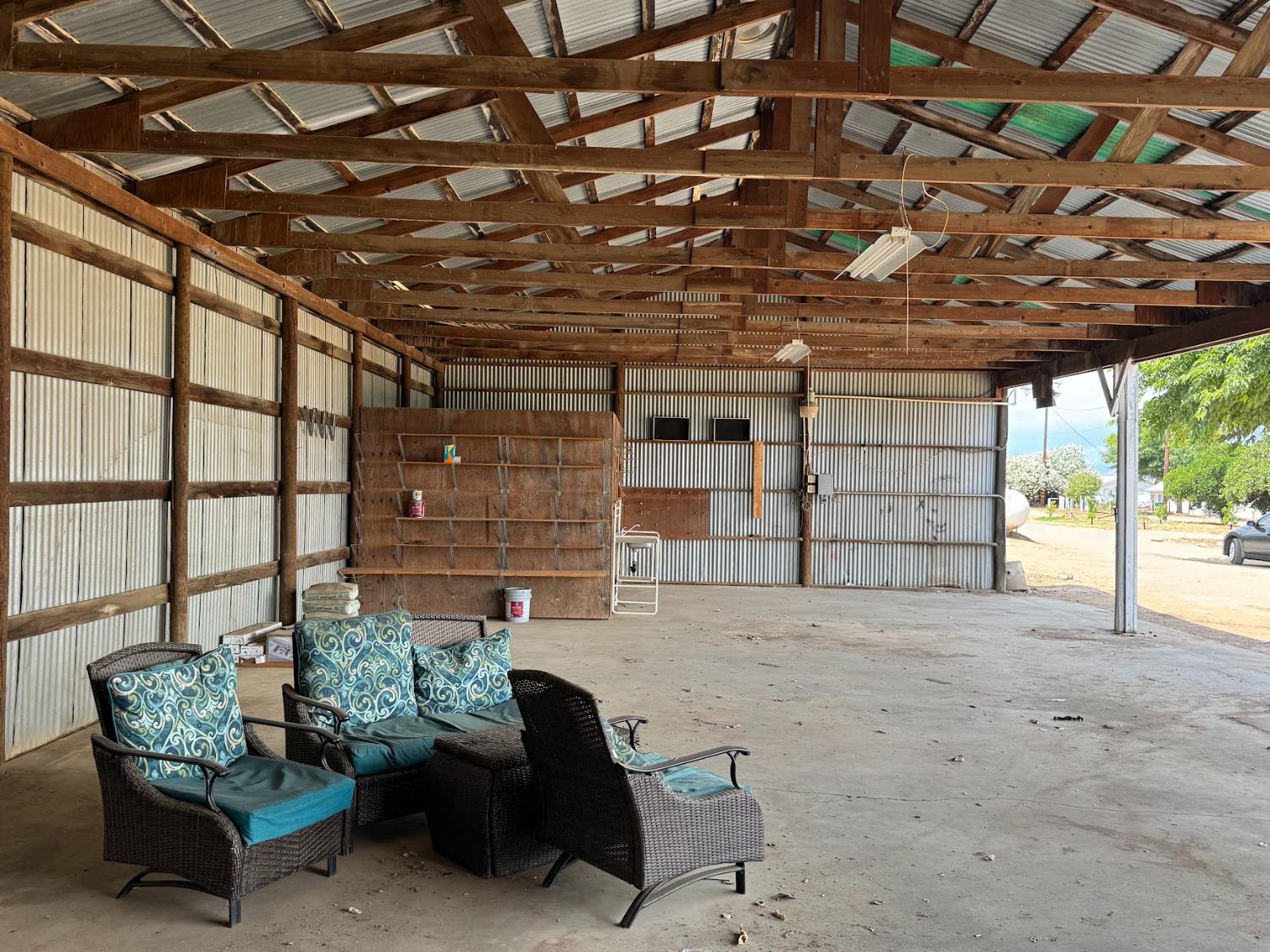 21293 East American Avenue Reedley, CA 93654 - Photo 18 of 19 a view of a patio with table and chairs and potted plants