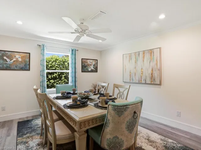a dining room with furniture and window