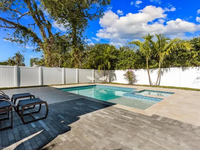 a view of backyard with outdoor seating