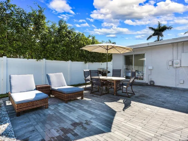 a view of a patio with furniture