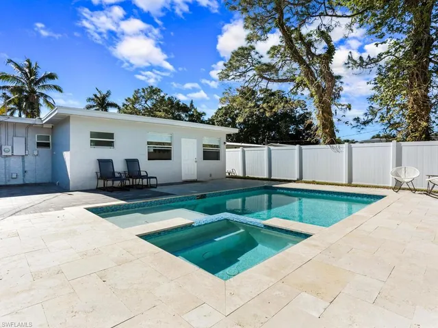 a view of a backyard with a patio