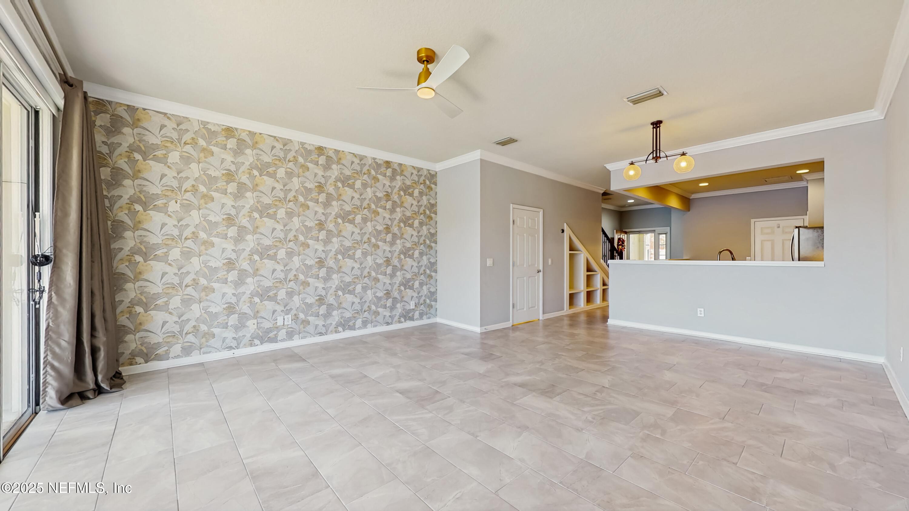 7030 Roundleaf Drive Jacksonville, FL 32258 - Photo 18 of 39 a view of a big room with wooden floor and windows