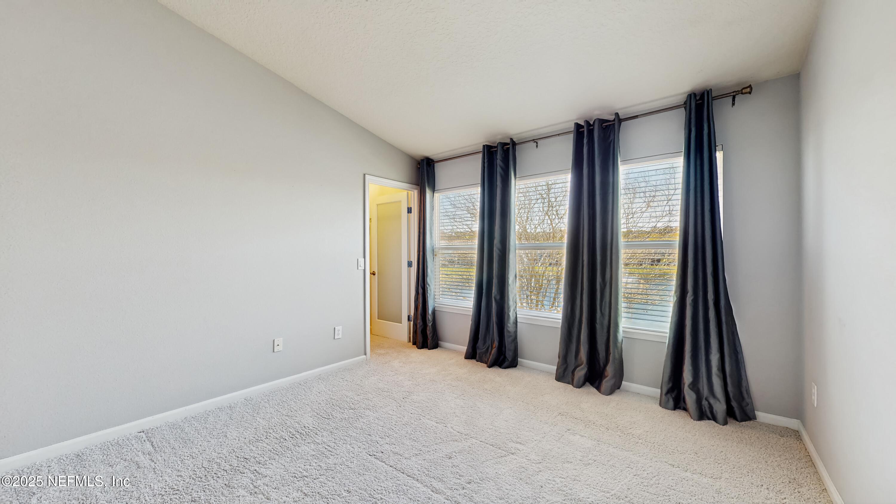 7030 Roundleaf Drive Jacksonville, FL 32258 - Photo 22 of 39 an empty room with a window