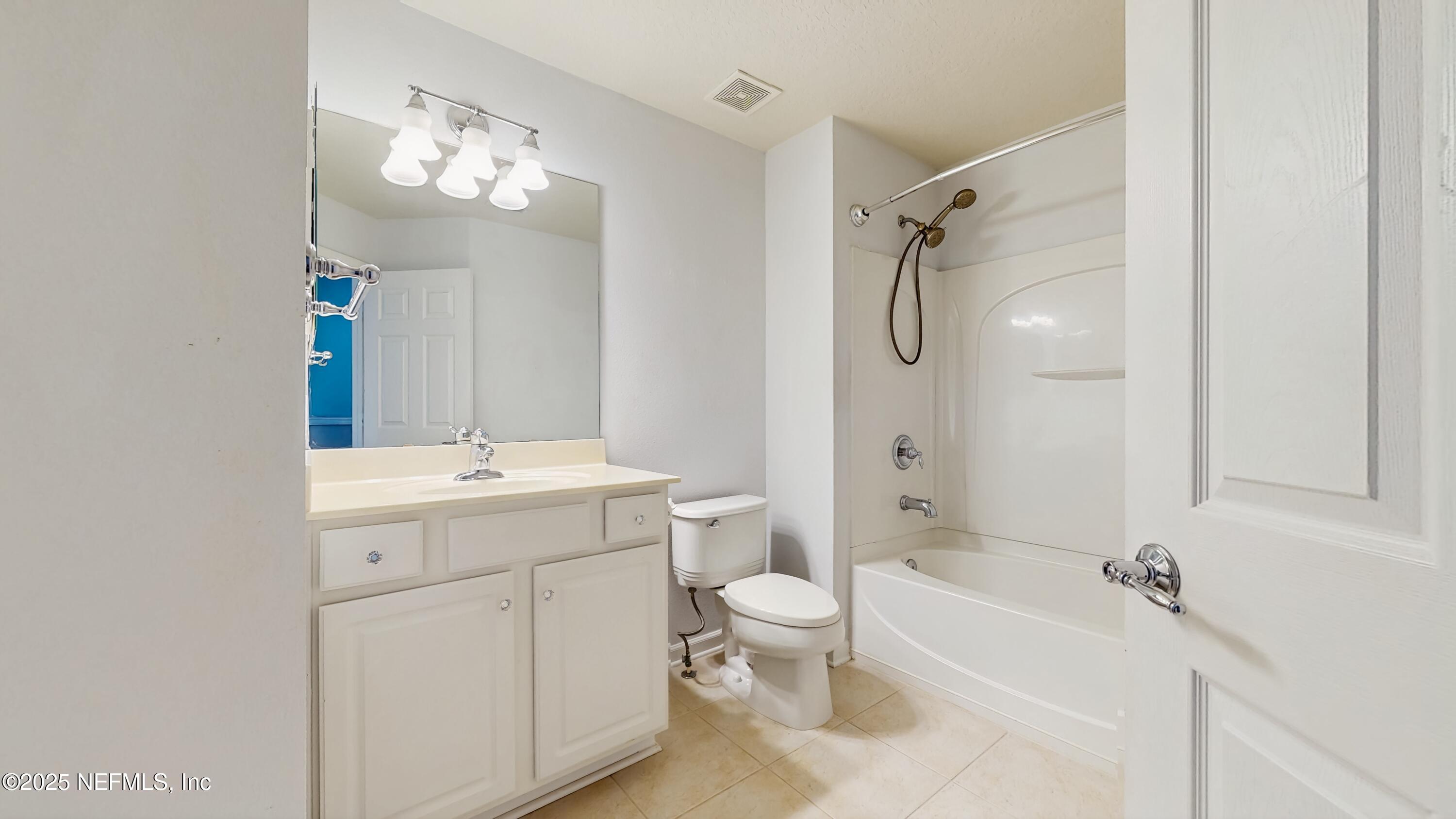7030 Roundleaf Drive Jacksonville, FL 32258 - Photo 25 of 39 a bathroom with a sink a toilet and shower