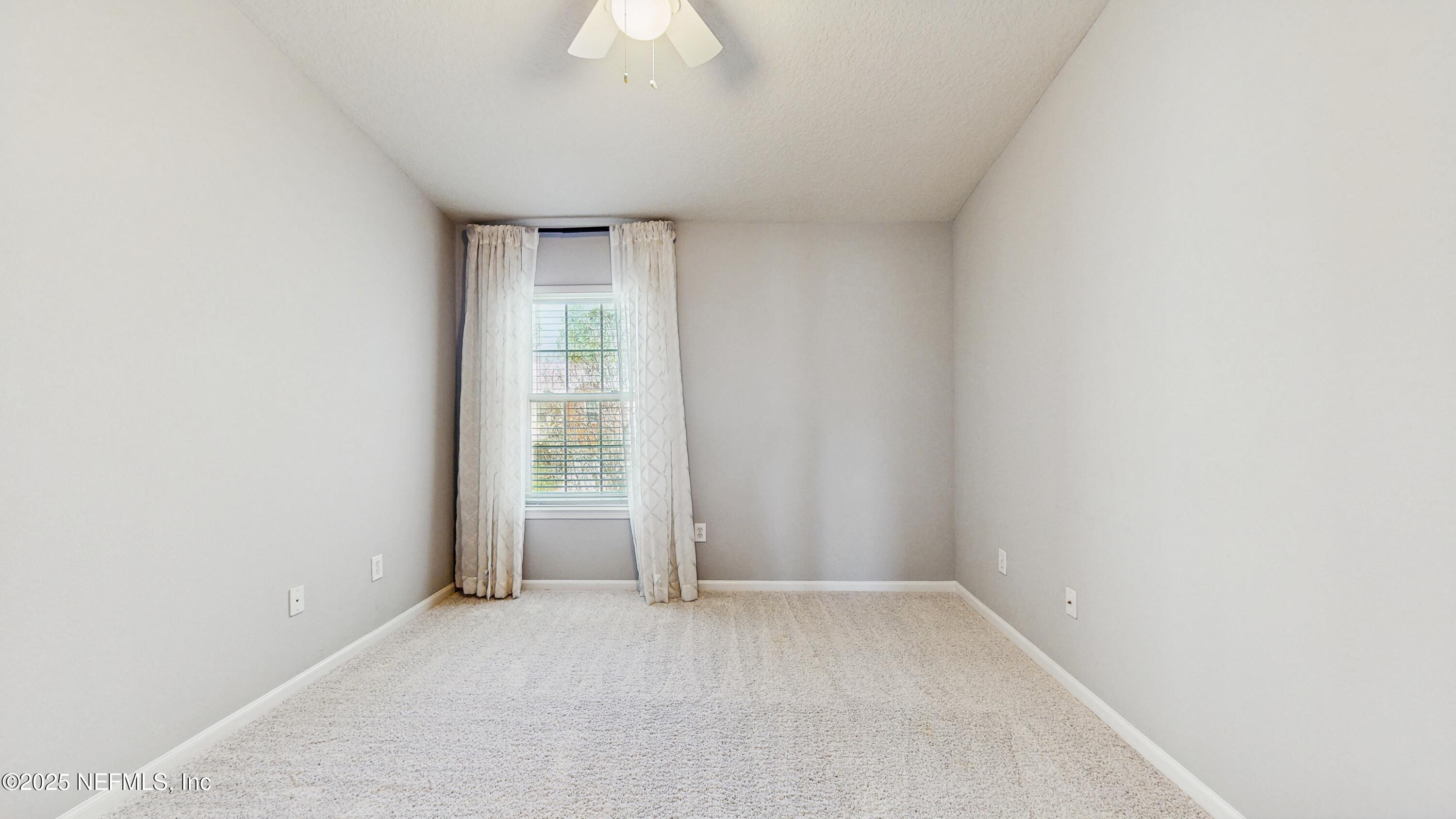 7030 Roundleaf Drive Jacksonville, FL 32258 - Photo 26 of 39 a view of an empty room with a window