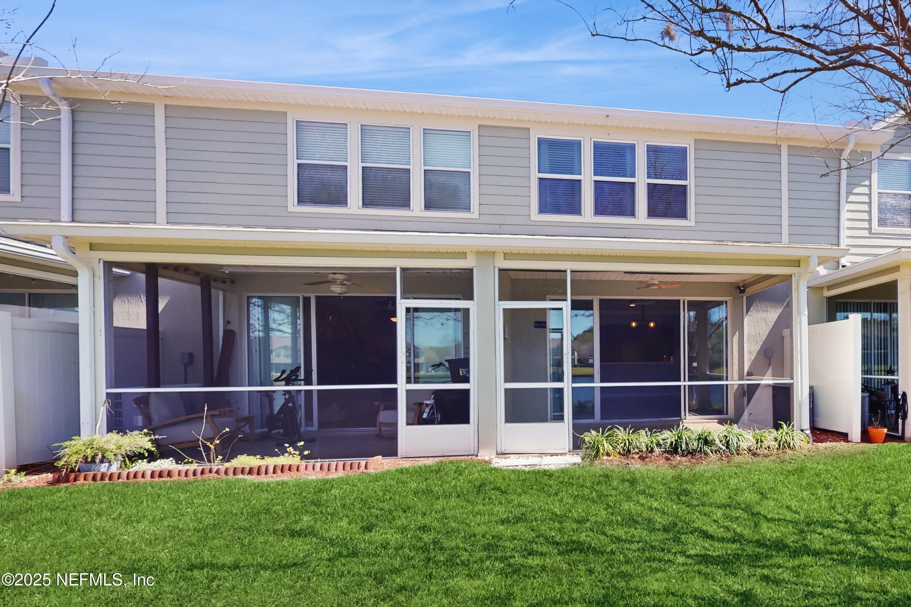 7030 Roundleaf Drive Jacksonville, FL 32258 - Photo 32 of 39 a front view of a brick house with a yard