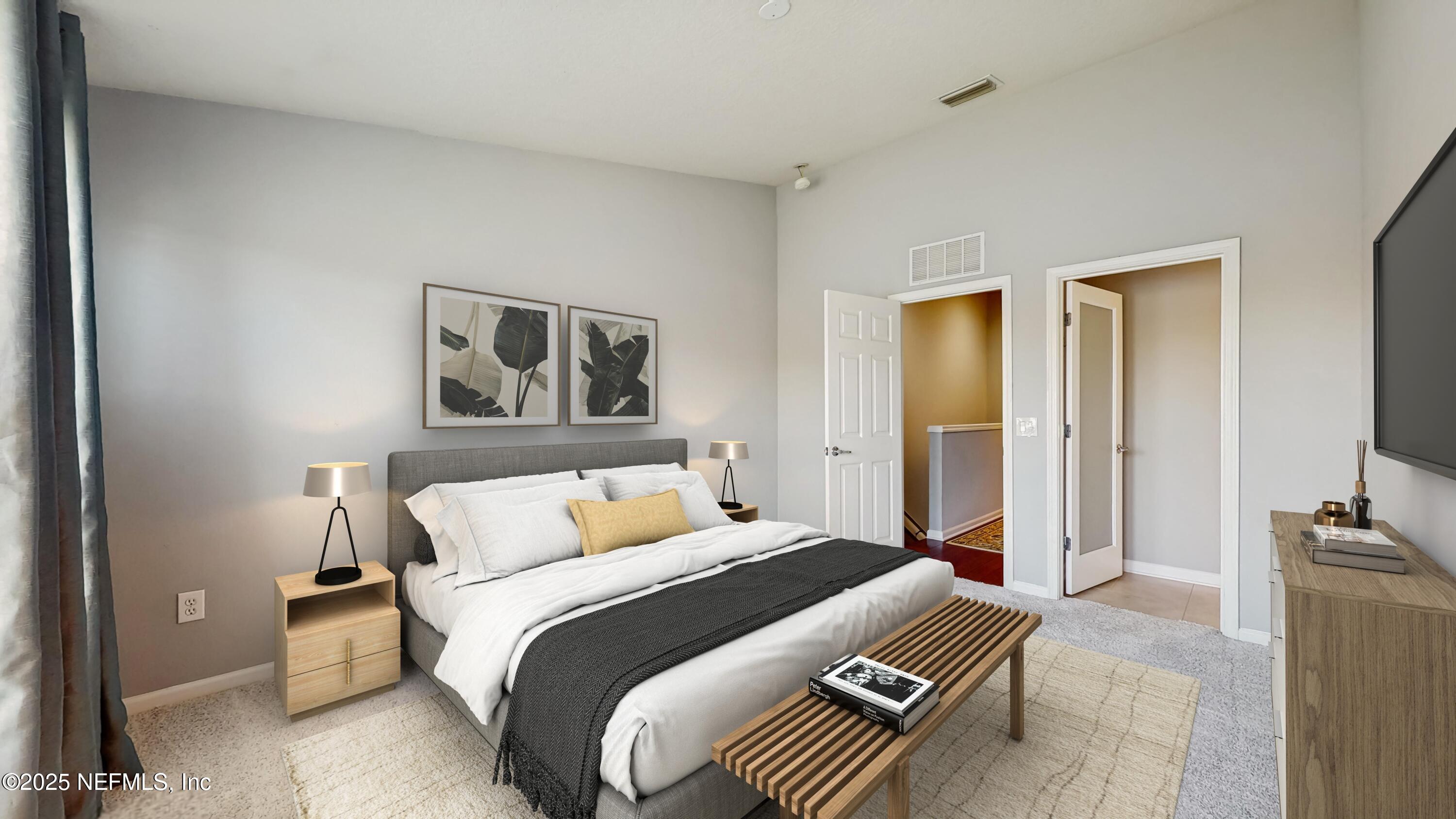 7030 Roundleaf Drive Jacksonville, FL 32258 - Photo 7 of 39 a bedroom with a bed and a flat screen tv