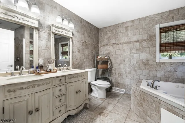 a bed room with a bed and a window