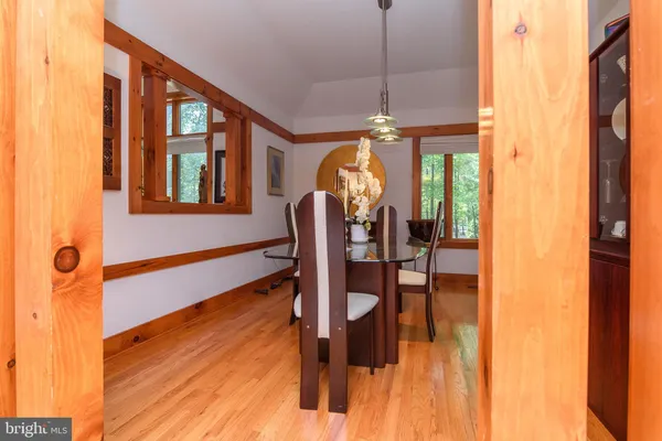 a view of a living room with furniture window and wooden floor