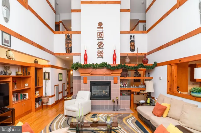 a balcony filled with furniture and a fireplace