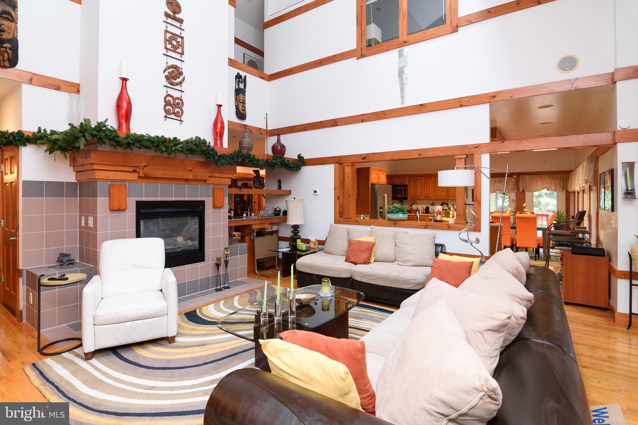 23615 Quail Hollow Circle Lewes, DE 19958 - Photo 20 of 49 a view of a patio with couches chairs and a fireplace