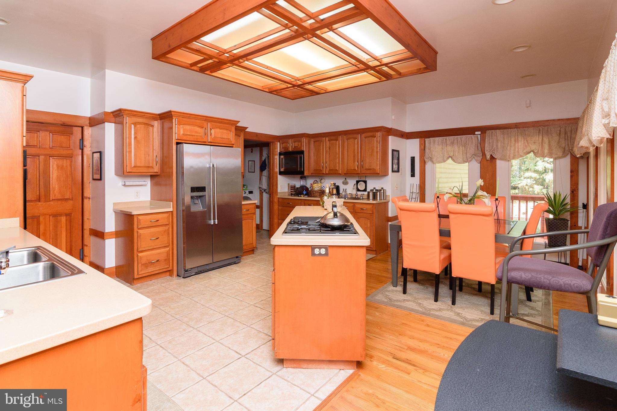 23615 Quail Hollow Circle Lewes, DE 19958 - Photo 24 of 49 a living room with furniture a flat screen tv and next to a window