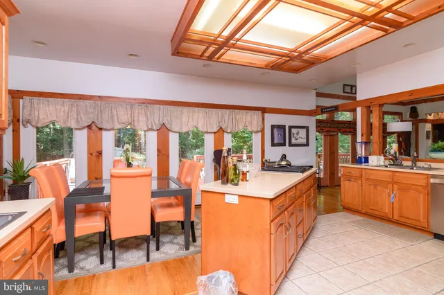 a open kitchen with stainless steel appliances granite countertop a stove and cabinets