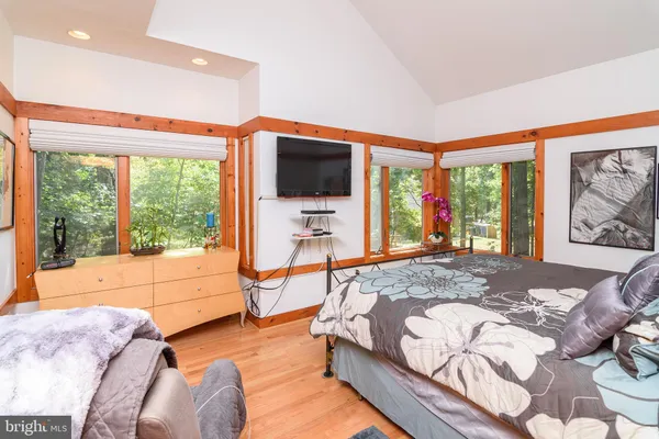 a living room with a large window and a flat screen tv