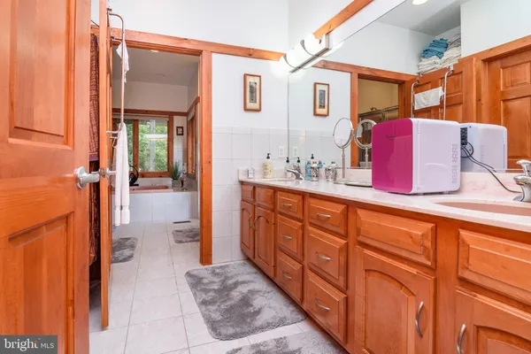 a bathroom with a sink and mirror