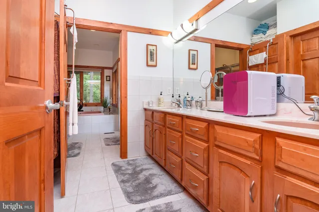 a bathroom with a sink and mirror