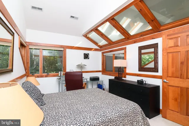 a kitchen with a large window and counter space