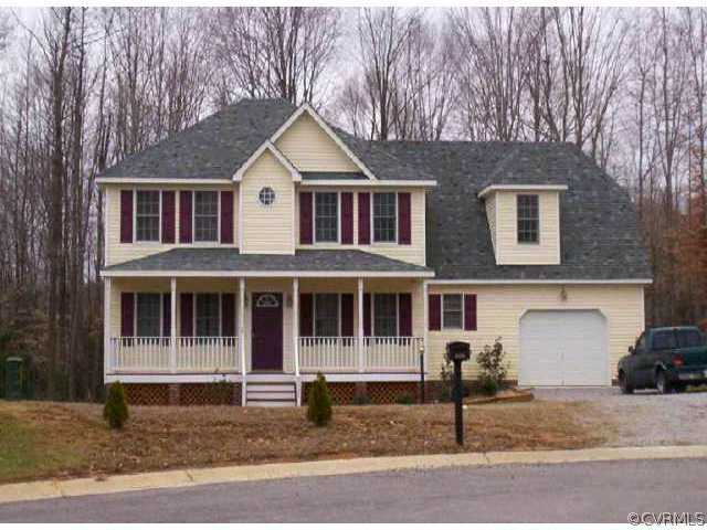 5525 Takach Road Prince George, VA 23875 - Photo 1 of 1 a front view of a house with a yard and garage